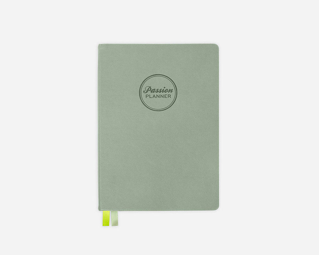 Green hardcover planner with &